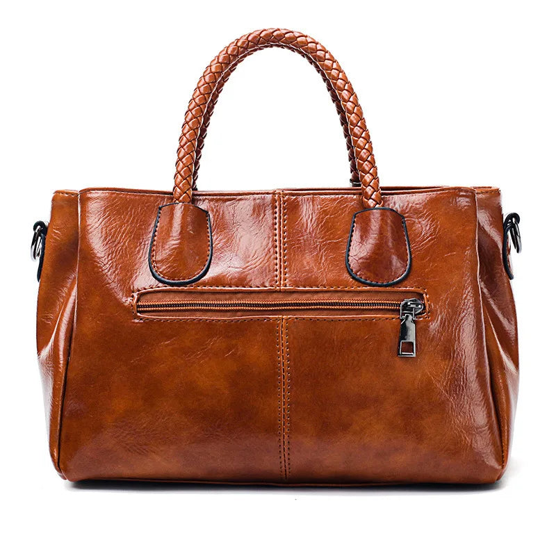 Pia™ | Elegante Lederhandtasche mit geflochtenen Griffen