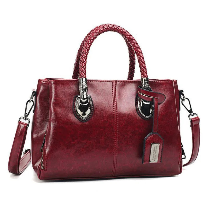 Pia™ | Elegante Lederhandtasche mit geflochtenen Griffen