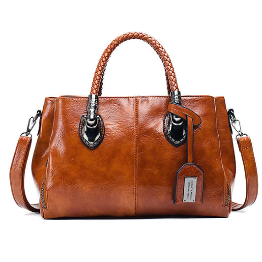 Pia™ | Elegante Lederhandtasche mit geflochtenen Griffen
