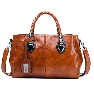 Pia™ | Elegante Lederhandtasche mit geflochtenen Griffen